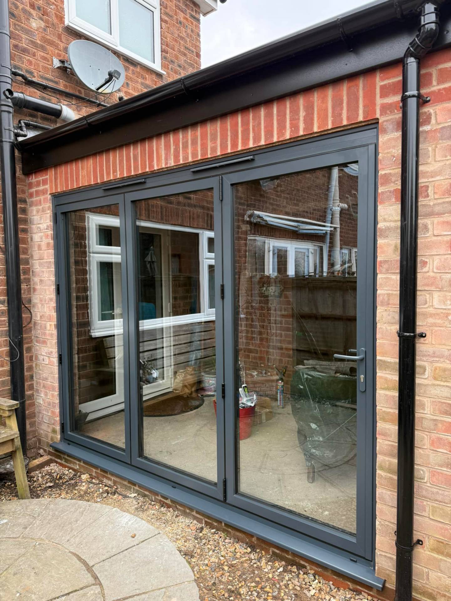 Anthracite aluminium bifold doors on a Shropshire extension opening to the garden